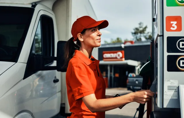 Woman fueling her van